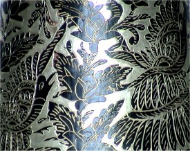 Folk Art Black Background Silver Copper Vase Close-Up
